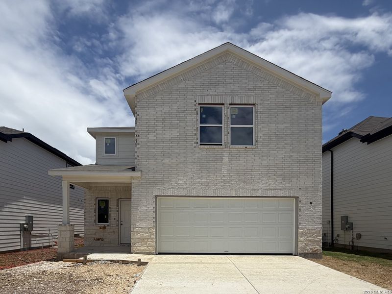Front exterior of a new home in Hennersby Hollow, San Antonio, TX, highlighting curb appeal (Image 1). Front exterior of a new home in Hennersby Hollow, San Antonio, TX, highlighting curb appeal (Image 1).