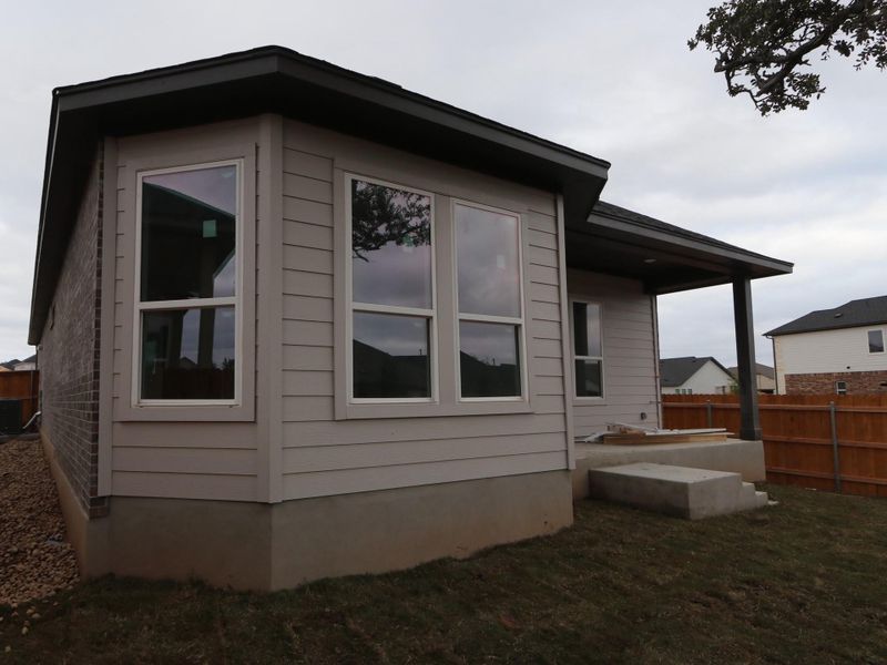Exterior details and patio area of a home in Heritage, Dripping Springs (Image 7).