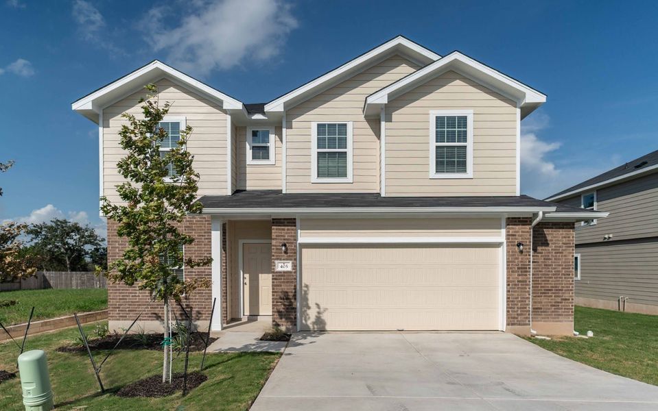 Front exterior of a new home in Grande Estates, Bertram, TX, highlighting curb appeal (Image 1). Front exterior of a new home in Grande Estates, Bertram, TX, highlighting curb appeal (Image 1).