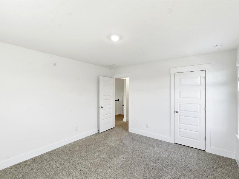 Spacious, unfurnished interior of a new home in The Coves at Lakes of Cane Bay II, Summerville (Image 36).