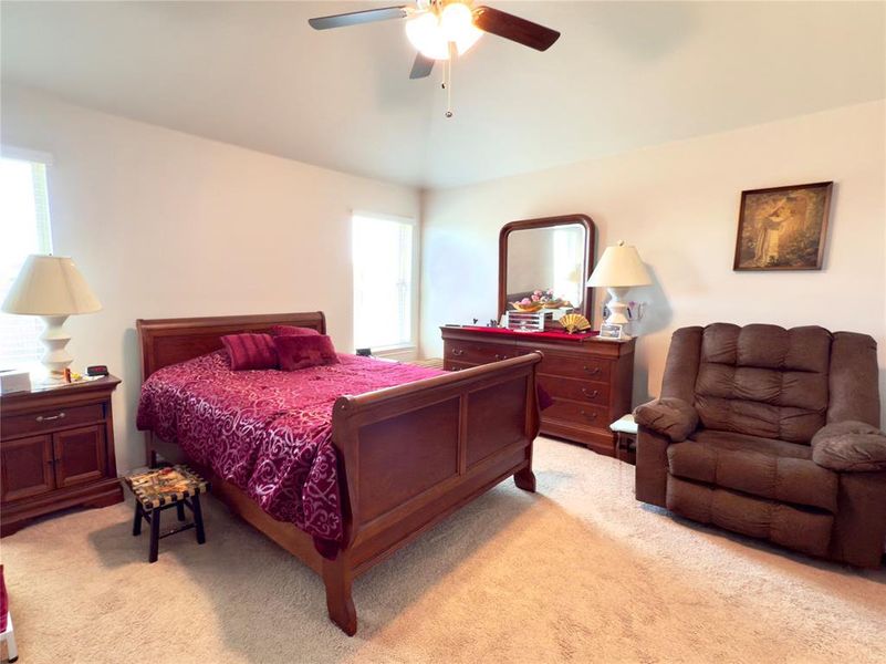 Bedroom with light colored carpet and ceiling fan Bedroom with light colored carpet and ceiling fan