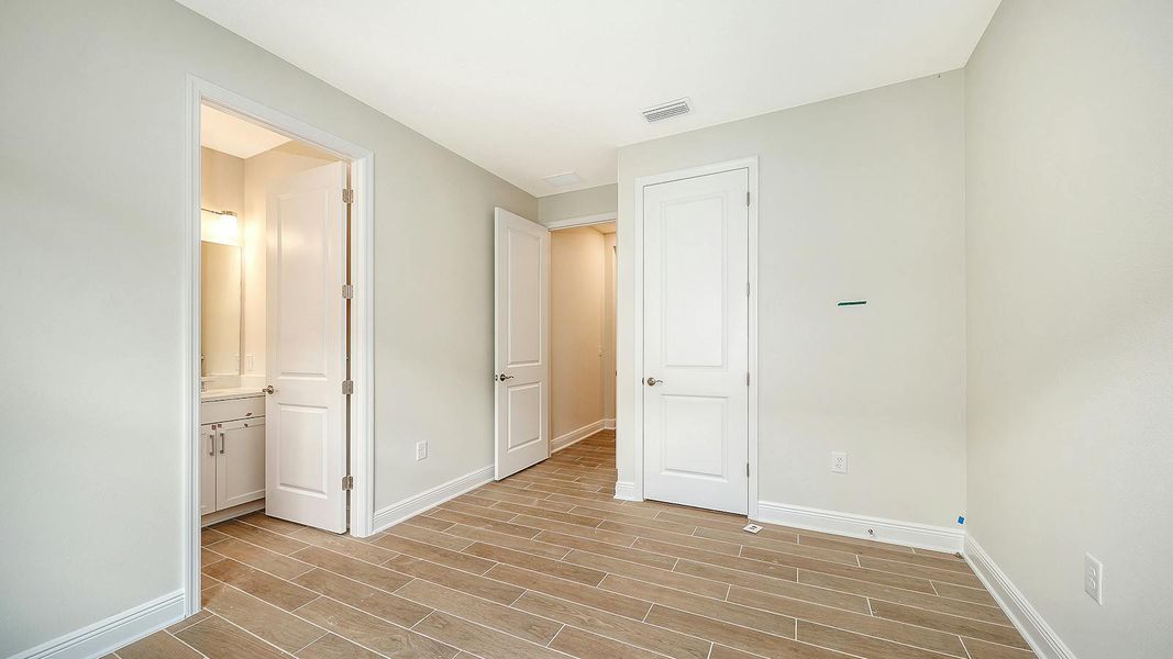 Spacious, unfurnished interior of a new home in Grand Park Real Estate and Homes for Sale in Sarasota, FL - Neal Communities, Sarasota (Image 38).