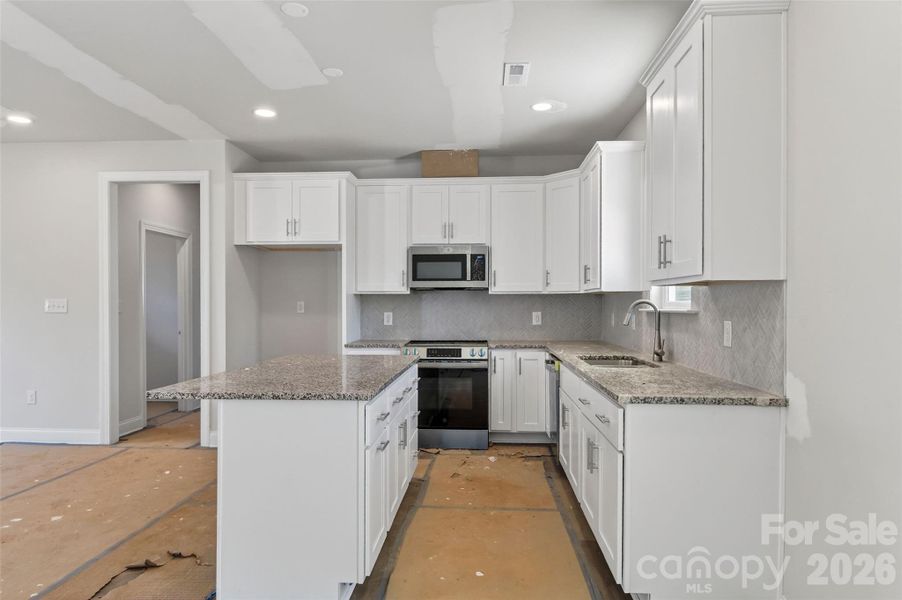 Furnished interior view inside a new home in , Statesville (Image 7).