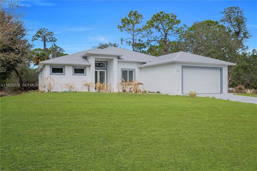 Front exterior of a new home in , Lehigh Acres, FL, highlighting curb appeal (Image 21).