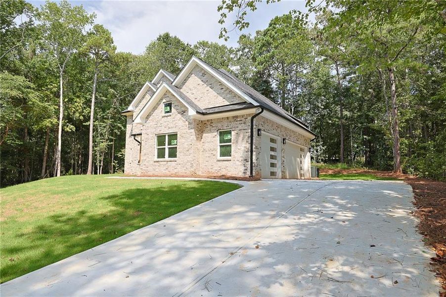 Front exterior of a new home in , McDonough, GA, highlighting curb appeal (Image 20).