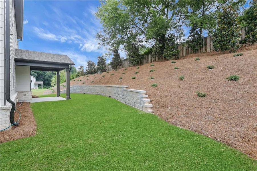 Exterior details and patio area of a home in The Paddocks at Doc Hughes, Buford (Image 3).