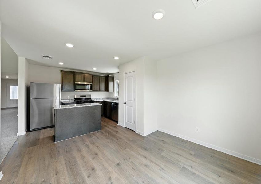 The dining room of sits right off of the kitchen.