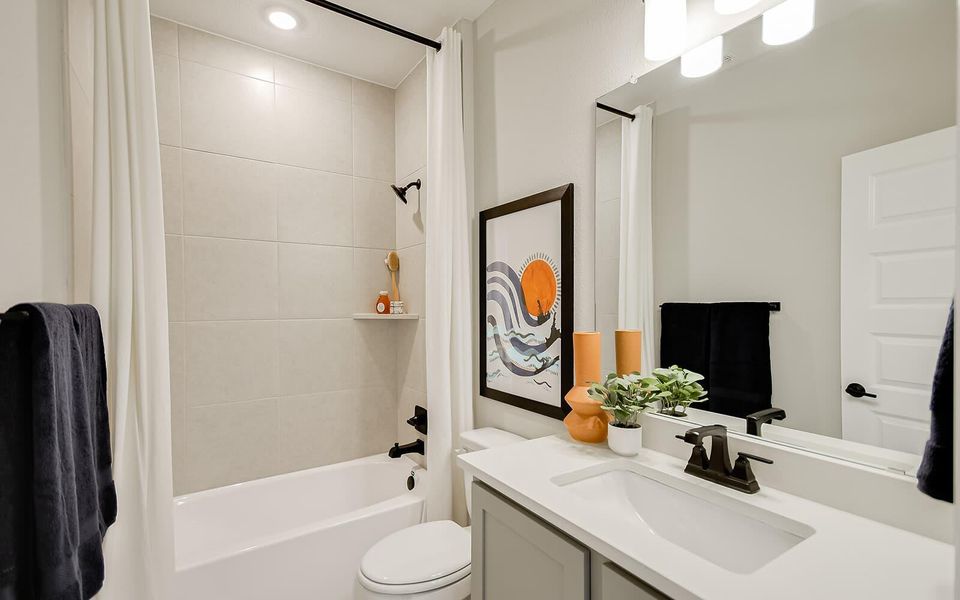Full bath with vanity, shower / tub combo with curtain, and recessed lighting