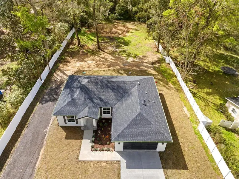 Front exterior of a new home in , Brooksville, FL, highlighting curb appeal (Image 17).