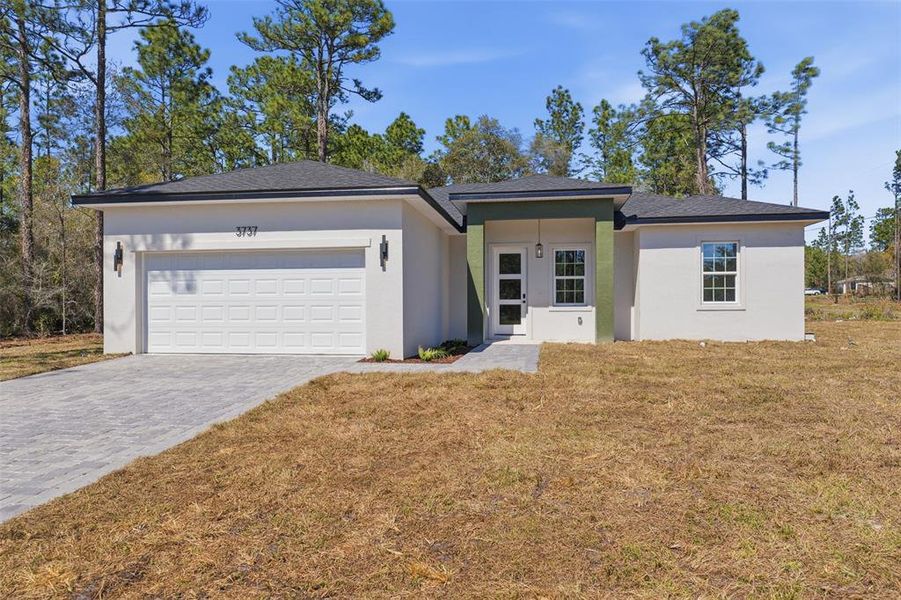 Front exterior of a new home in , Citrus Springs, FL, highlighting curb appeal (Image 21). Front exterior of a new home in , Citrus Springs, FL, highlighting curb appeal (Image 21).