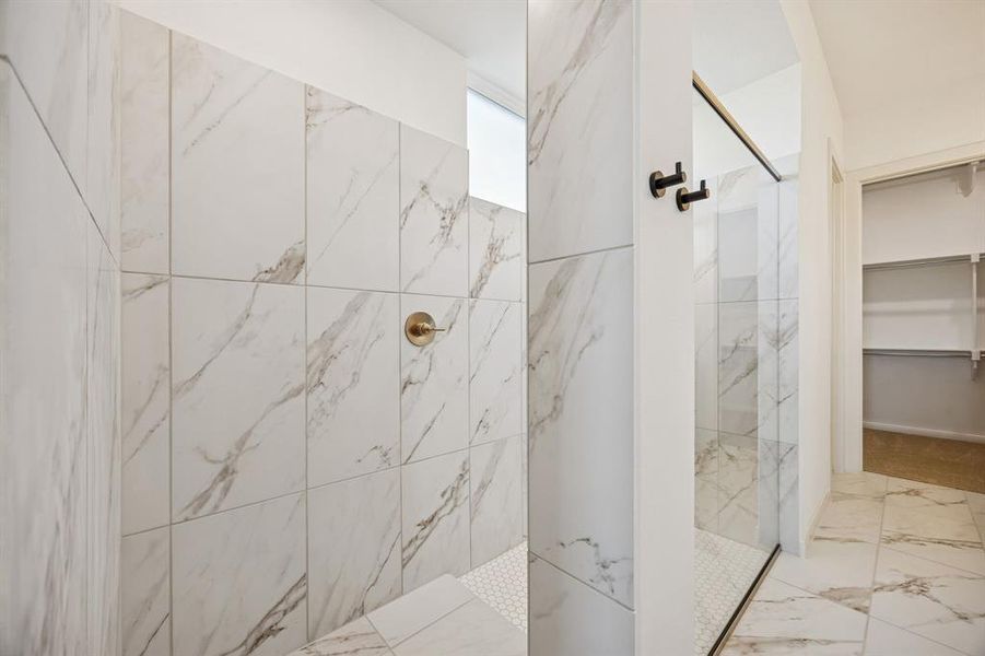 Offering a luxurious walk in shower with drying area, this owner's bath is a dream come true!
