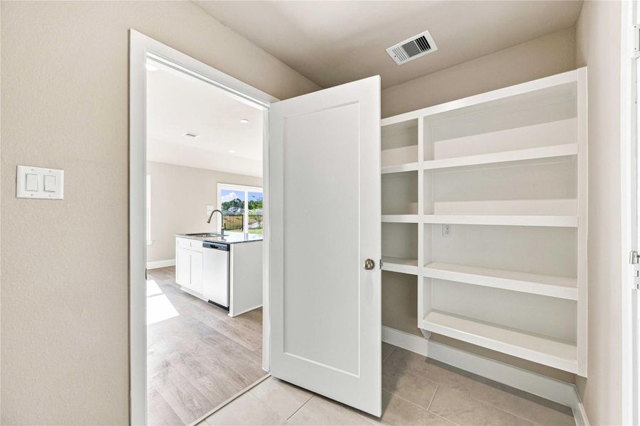 Furnished interior view inside a new home in Crockett Meadows, Conroe (Image 9).