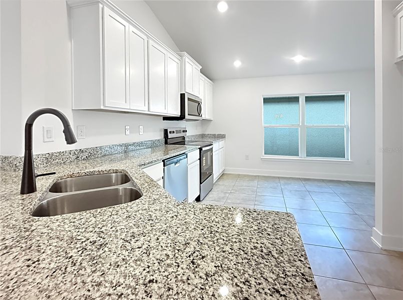 Furnished interior view inside a new home in Harmony Central, St. Cloud (Image 4).