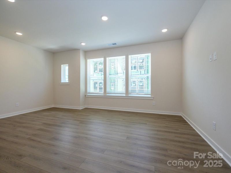 Spacious, unfurnished interior of a new home in Central Living at Craig, Charlotte (Image 23).