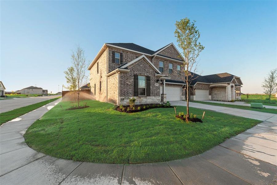 Front exterior of a new home in Walden Pond, Forney, TX, highlighting curb appeal (Image 14).