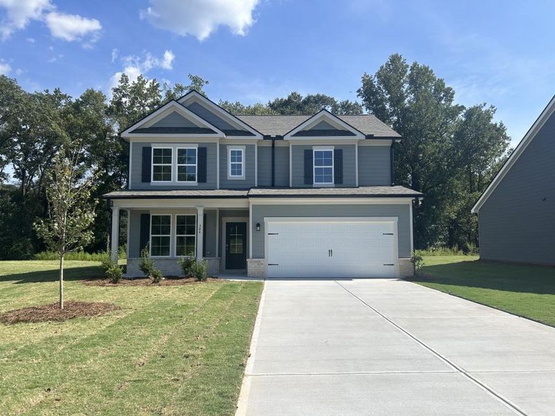 Front exterior of a new home in Red Bird Manor, Jefferson, GA, highlighting curb appeal (Image 1). Front exterior of a new home in Red Bird Manor, Jefferson, GA, highlighting curb appeal (Image 1).