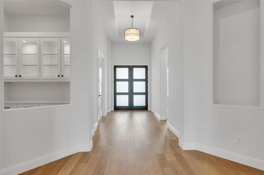 Entrance foyer featuring light hardwood / wood-style floors