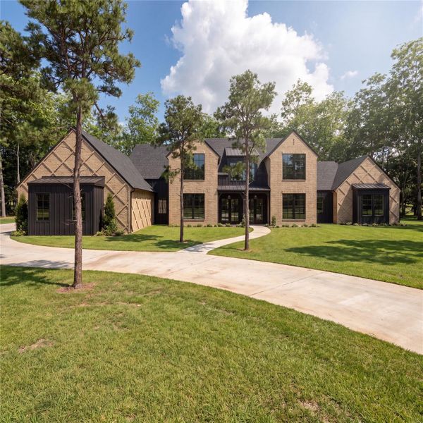 Front exterior of a new home in , Montgomery, TX, highlighting curb appeal (Image 10).