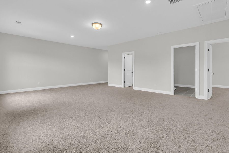 Spacious, unfurnished interior of a new home in Tidewater at Lakes of Cane Bay, Summerville (Image 43).