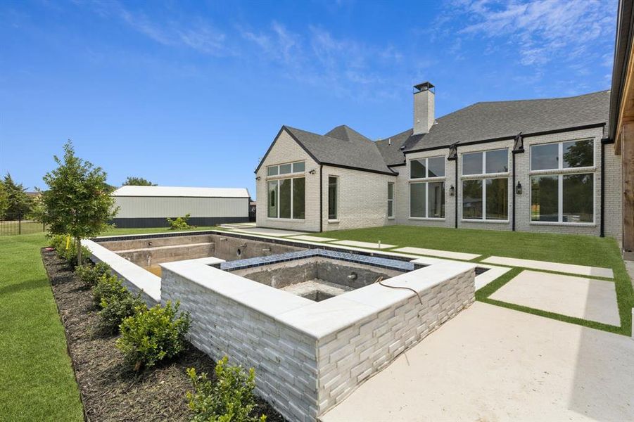 Luxurious modern designed pool and spa, smart app controlled, and central turf courtyard designed for all season entertainment.