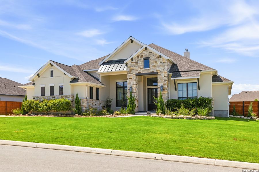 Front exterior of a new home in Megan's Landing, Castroville, TX, highlighting curb appeal (Image 21). Front exterior of a new home in Megan's Landing, Castroville, TX, highlighting curb appeal (Image 21).
