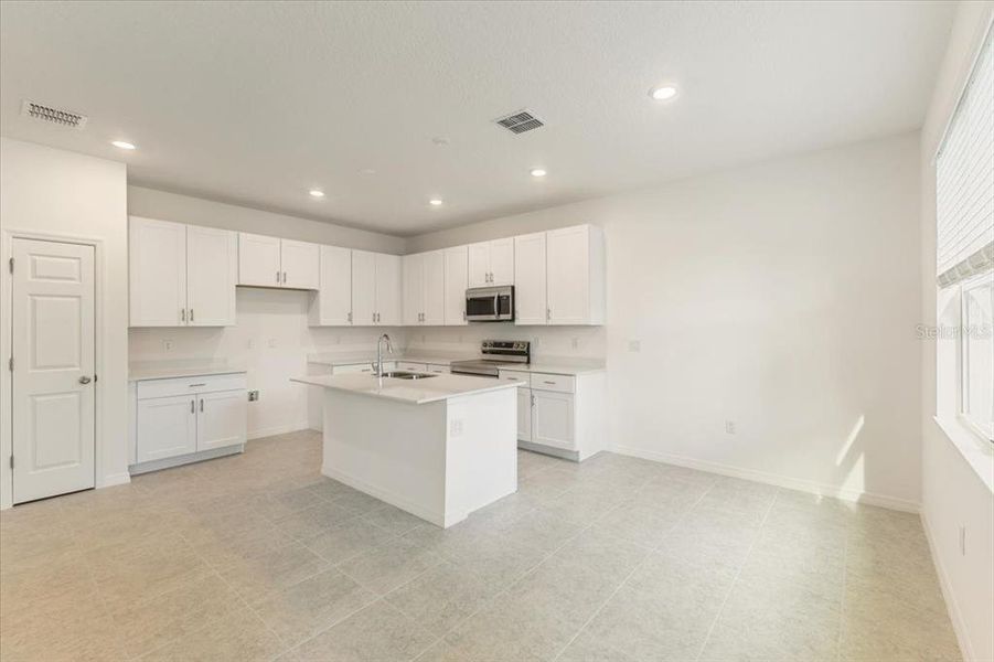 Furnished interior view inside a new home in Mirror Lake Village, Fruitland Park (Image 8).