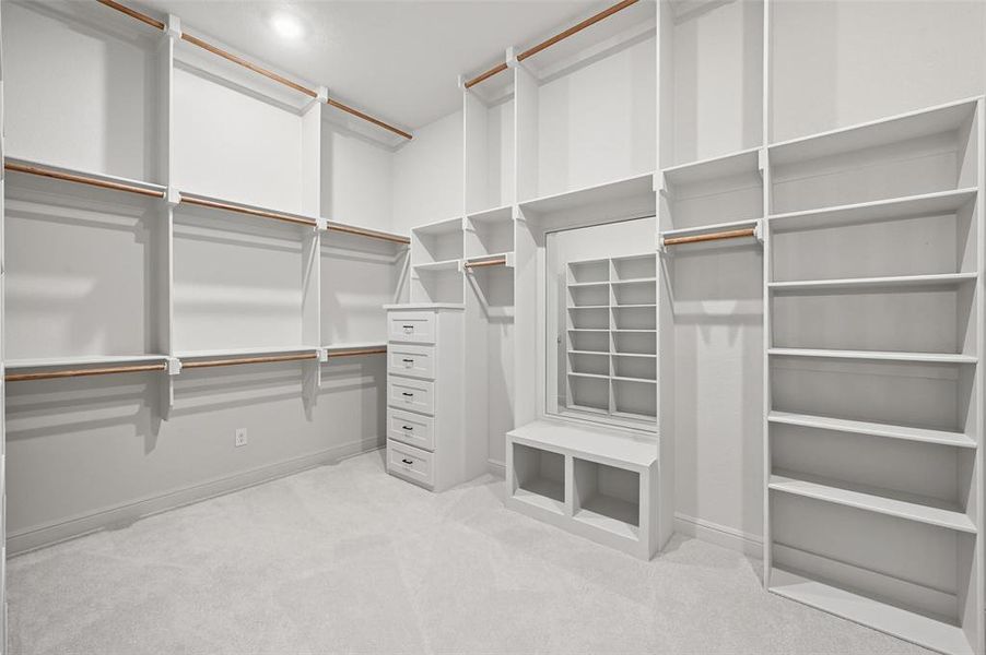 Walk in closet with light colored carpet Walk in closet with light colored carpet