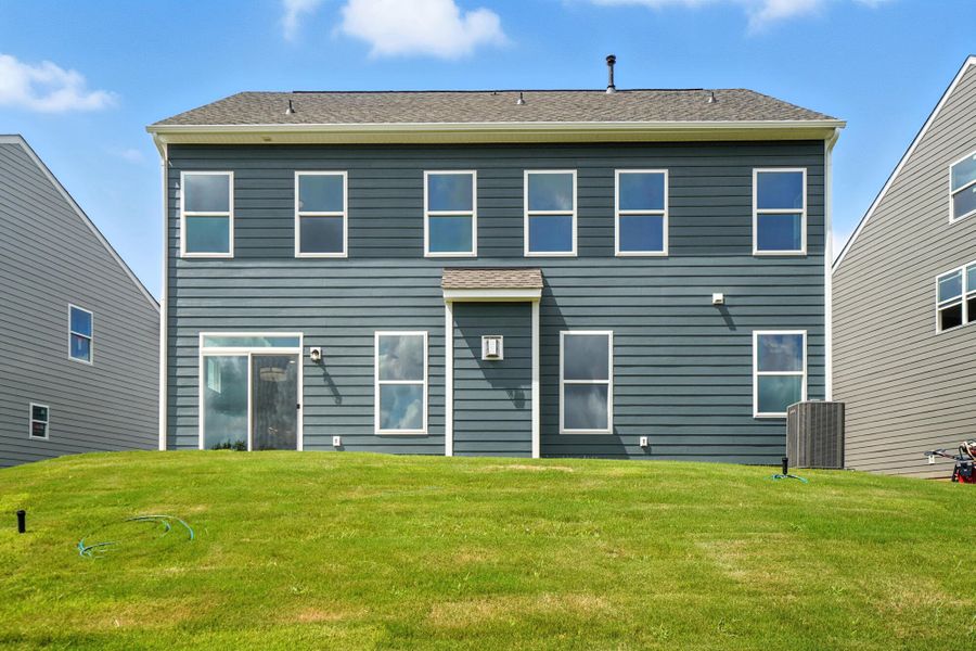 Front exterior of a new home in Summerlin, Mooresville, NC, highlighting curb appeal (Image 18). Front exterior of a new home in Summerlin, Mooresville, NC, highlighting curb appeal (Image 18).