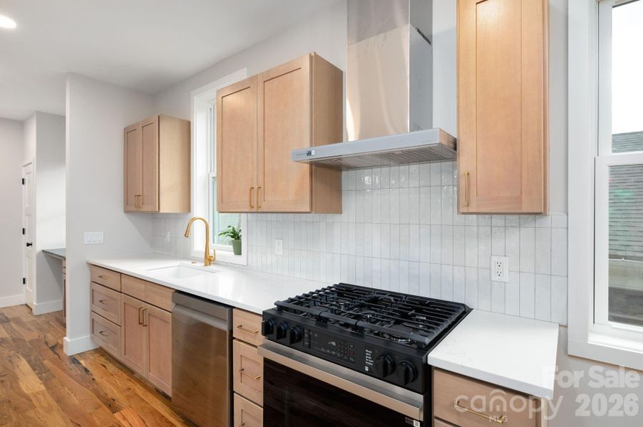 Tile Backsplash and a 5-Burner Gas Range