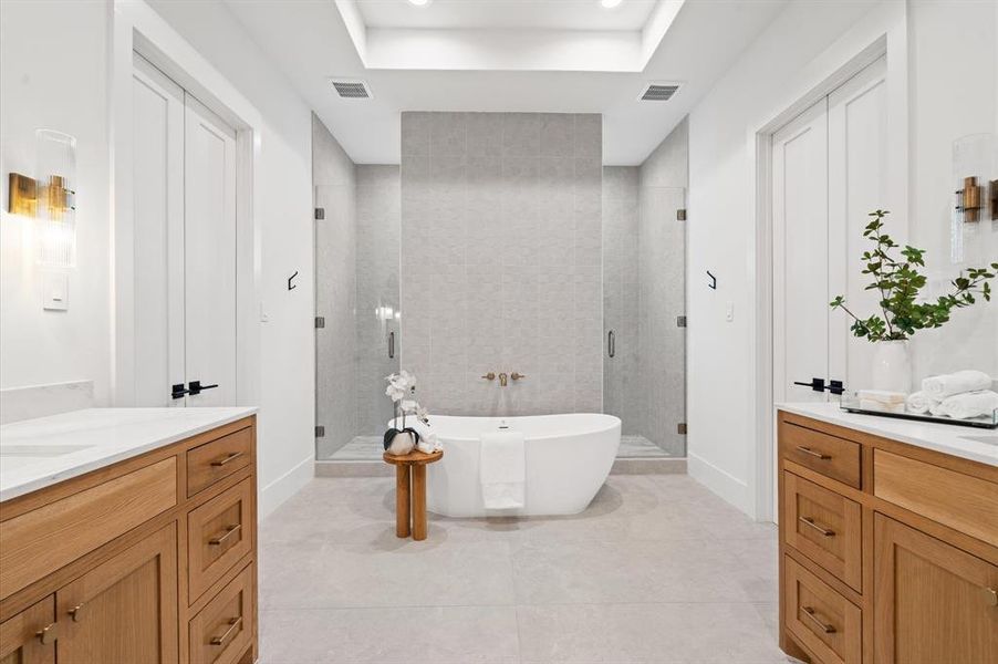 Primary bathroom with gorgeous soaking tub and double shower. Previous TOMO Homes project.