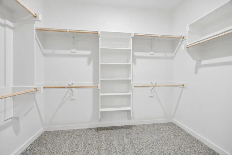 Walk-In Closet in the Birch home plan by Trophy Signature Homes – REPRESENTATIVE PHOTO Walk-In Closet in the Birch home plan by Trophy Signature Homes – REPRESENTATIVE PHOTO