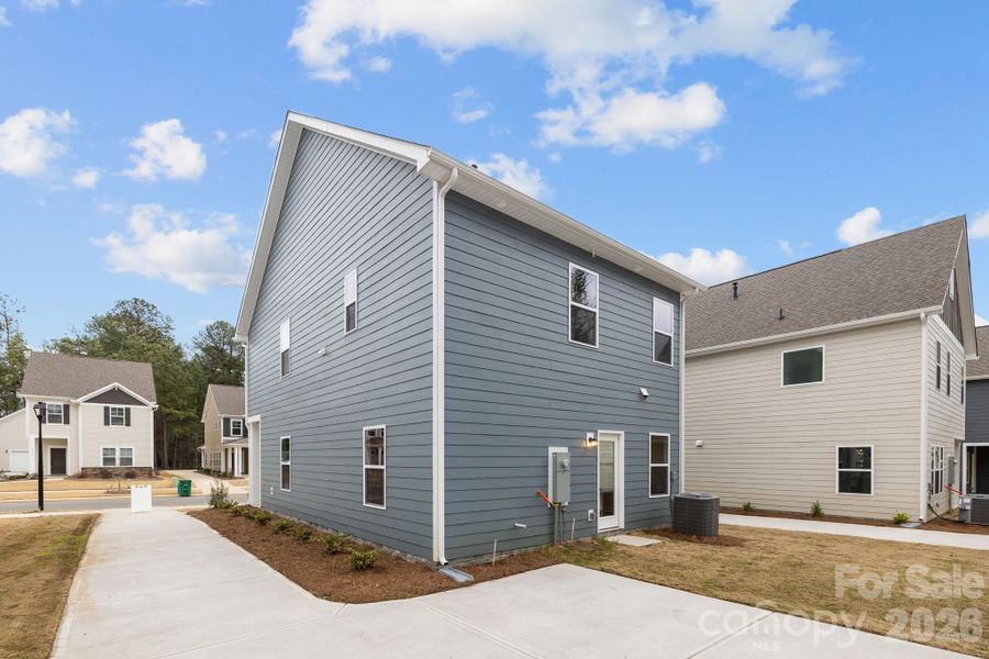 Exterior details and patio area of a home in Arbor Village, Matthews (Image 19).