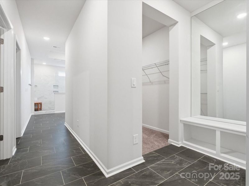 The HALLWAY of the primary bath/closets!