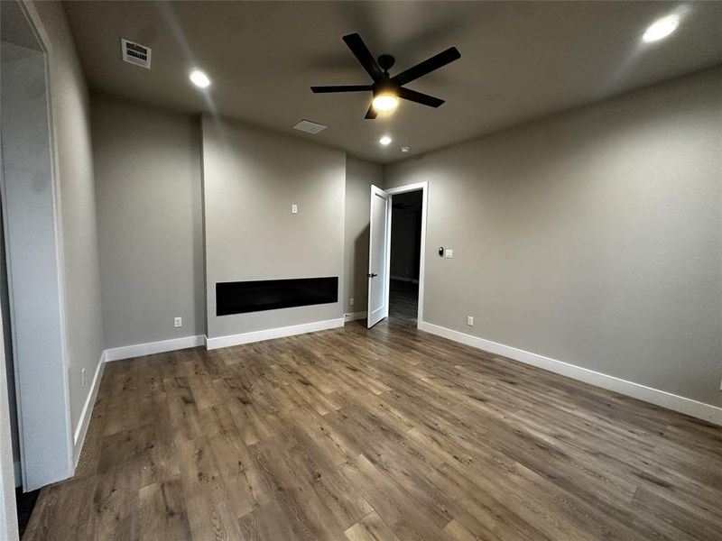 Spare room with ceiling fan, recessed lighting, and wood finished floors Spare room with ceiling fan, recessed lighting, and wood finished floors