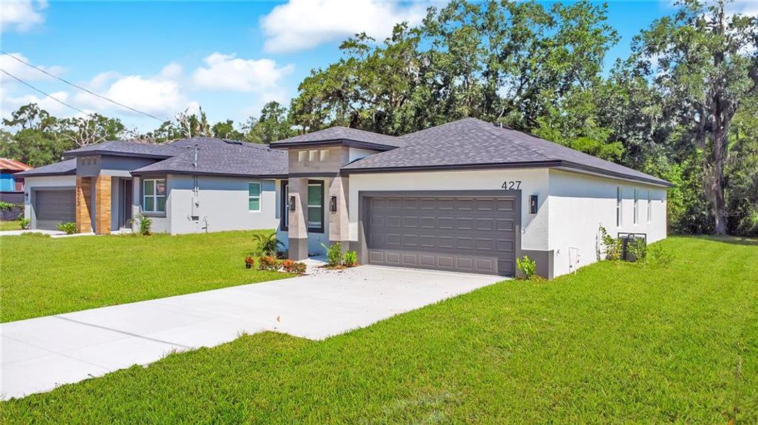 Front exterior of a new home in , Apopka, FL, highlighting curb appeal (Image 24).