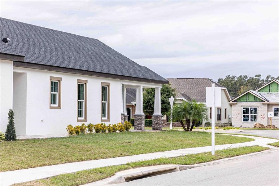 Front exterior of a new home in , Oxford, FL, highlighting curb appeal (Image 25).