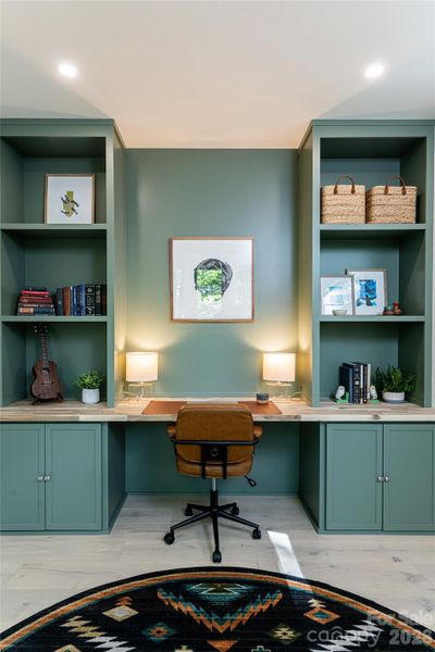 Main level flex space can be an office or an extra space to tuck guests in ....