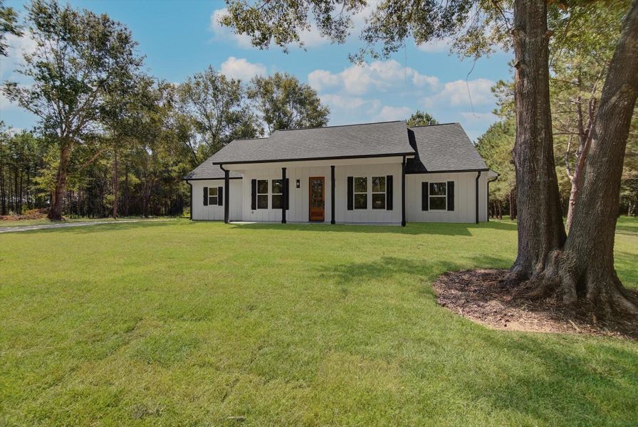 Front exterior of a new home in , Dayton, TX, highlighting curb appeal (Image 1). Front exterior of a new home in , Dayton, TX, highlighting curb appeal (Image 1).