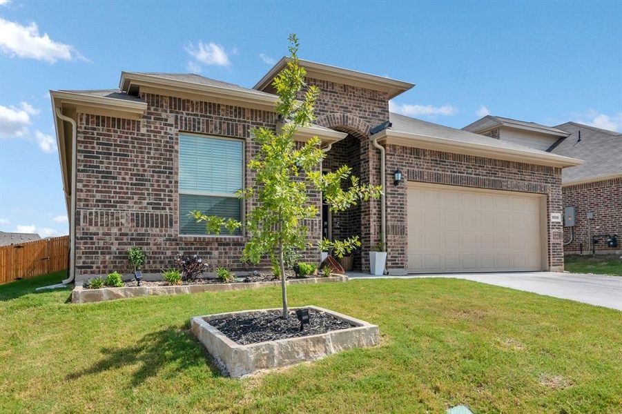 Ranch-style house with brick siding, concrete driveway, and a garage