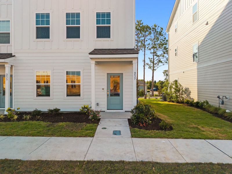 Exterior details and patio area of a home in Lakeside Townes at Riverlights, Wilmington (Image 3). Exterior details and patio area of a home in Lakeside Townes at Riverlights, Wilmington (Image 3).