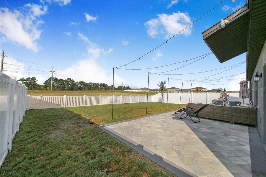 Exterior details and patio area of a home in Wind Meadows South, Bartow (Image 3).