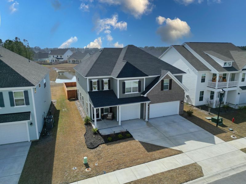 Front exterior of a new home in Hewing Farms, Summerville, SC, highlighting curb appeal (Image 25).