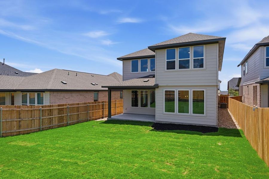 Exterior details and patio area of a home in Heritage, Dripping Springs (Image 22).