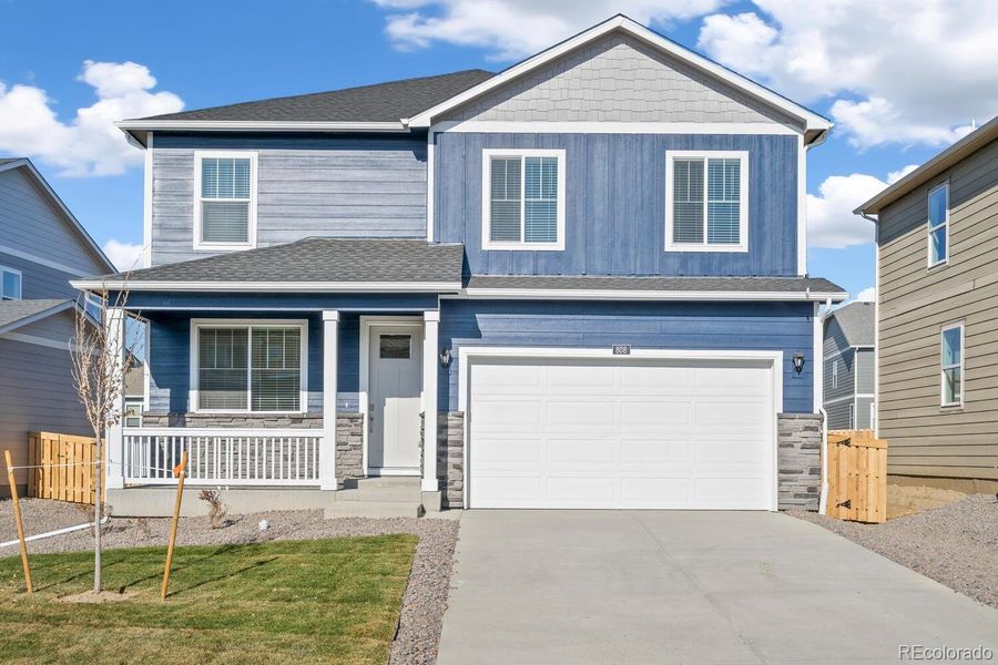 Front exterior of a new home in Trails at Crowfoot, Parker, CO, highlighting curb appeal (Image 2). Front exterior of a new home in Trails at Crowfoot, Parker, CO, highlighting curb appeal (Image 2).