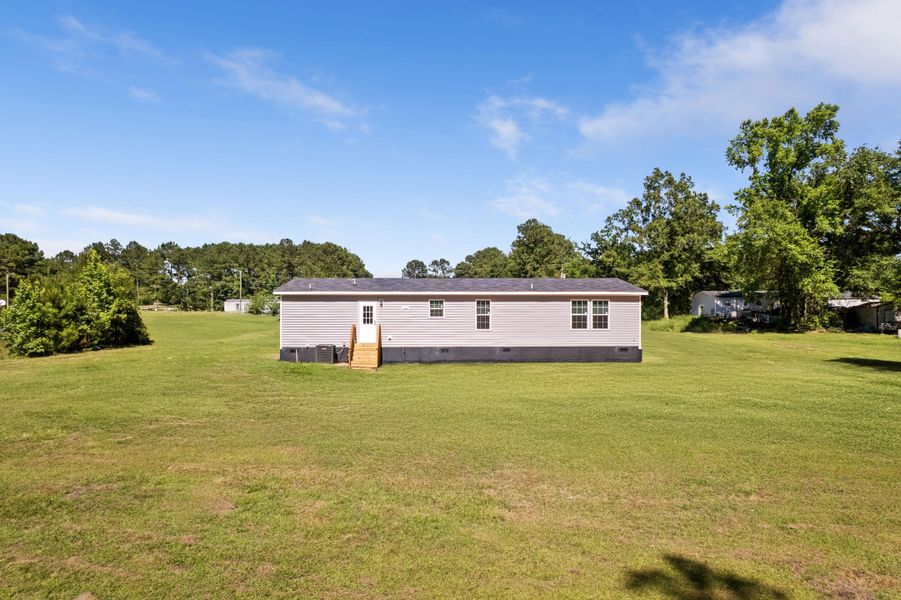 Exterior details and patio area of a home in , Cross (Image 24).