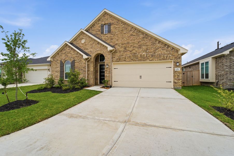 Front exterior of a new home in Mulberry Farms, Santa Fe, TX, highlighting curb appeal (Image 23). Front exterior of a new home in Mulberry Farms, Santa Fe, TX, highlighting curb appeal (Image 23).
