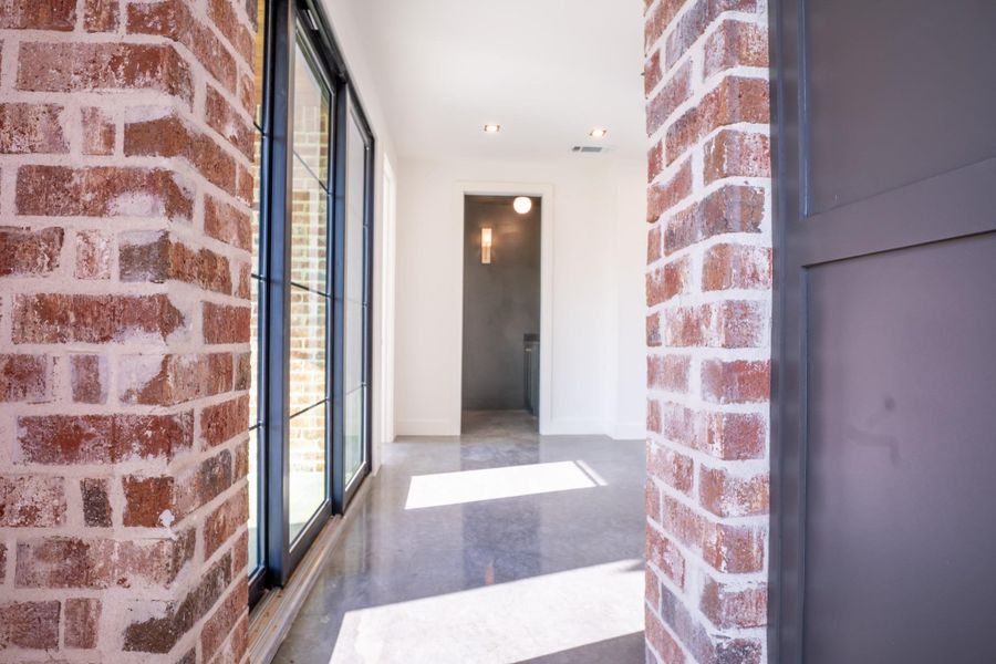 Entrance to property with brick siding