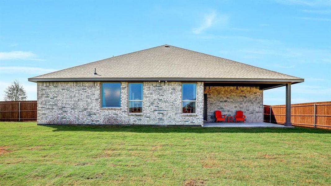 Rear Elevation and covered back Patio - All Home and community information, including pricing, included features, terms, availability and amenities, are subject to change at any time without notice or obligation. All Drawings, pictures, photographs, video, square footages, floor plans, elevations, features, colors and sizes are approximate for illustration purposes only and will vary from the homes as built.