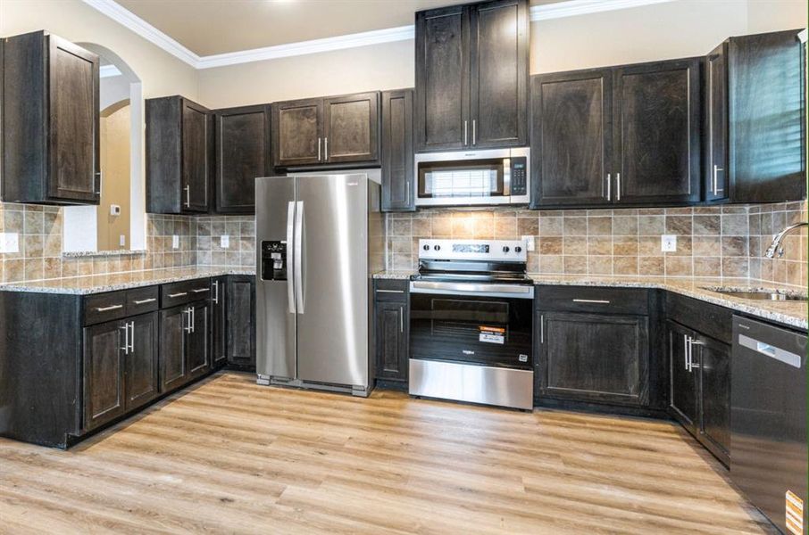 Custom tall cabinetry and stainless appliances - refrigerator included