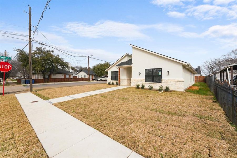Front exterior of a new home in , Dallas, TX, highlighting curb appeal (Image 23).